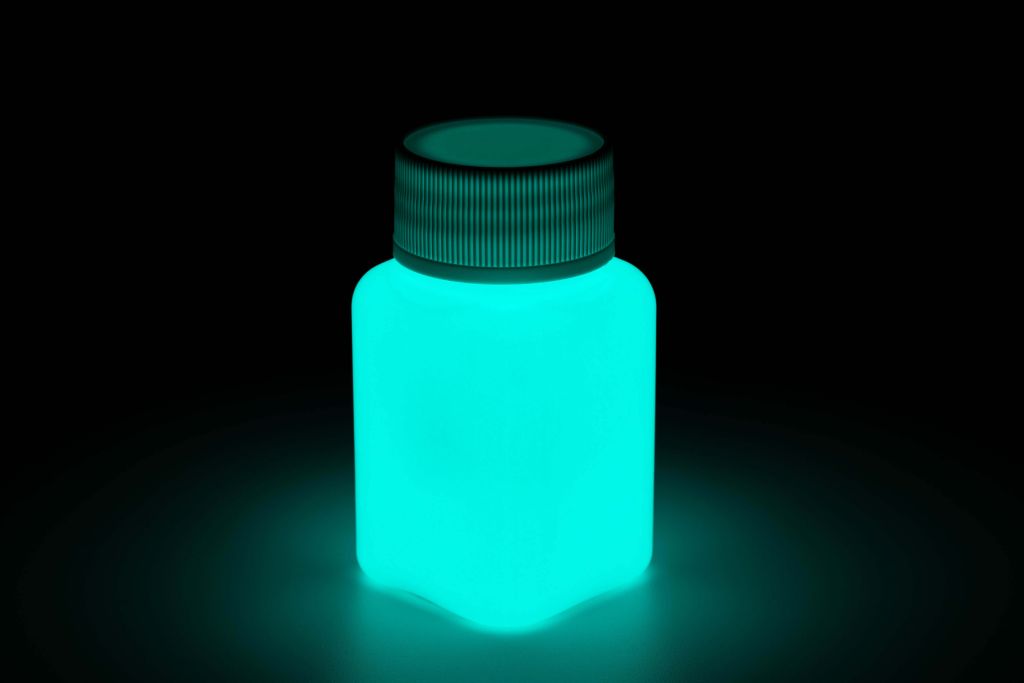 Glow paint in a jar, blue-green, glowing in the dark