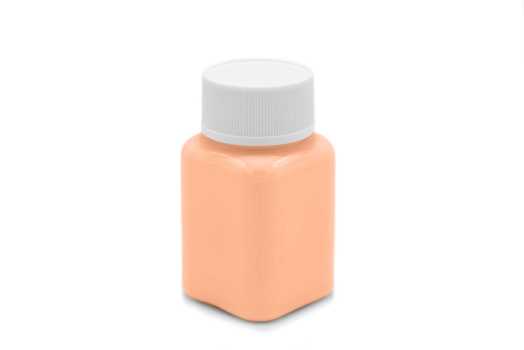 Glow paint in a jar, orange, in daylight